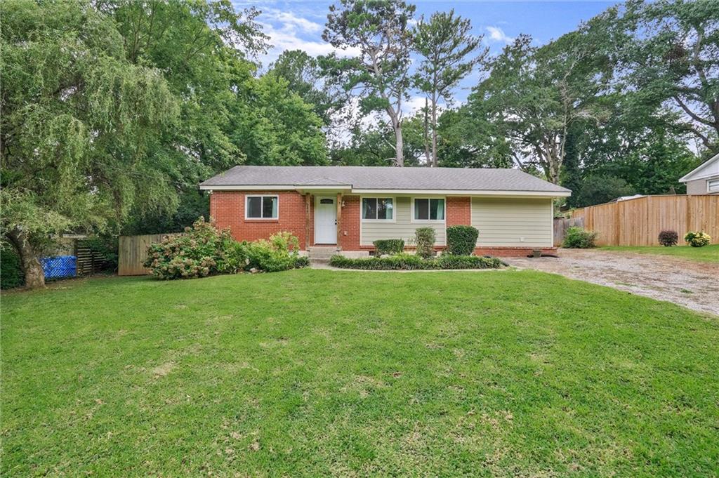 3225 Spring Drive Northwest Atlanta, GA 30360 - Photo 2 of 28 a front view of house with yard and green space