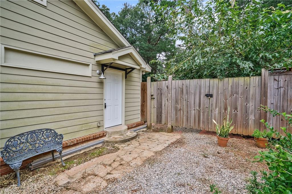 3225 Spring Drive Northwest Atlanta, GA 30360 - Photo 28 of 28 a backyard of a house with plants and wooden fence