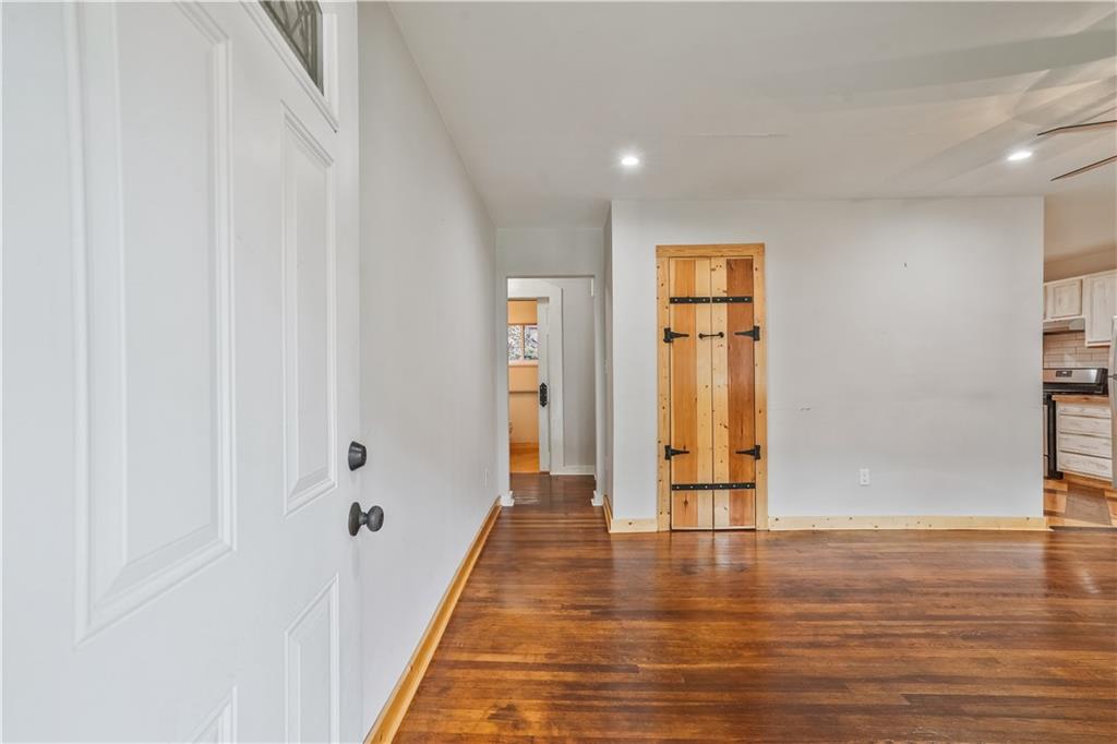 3225 Spring Drive Northwest Atlanta, GA 30360 - Photo 4 of 28 a view of a hallway with wooden floor and closet