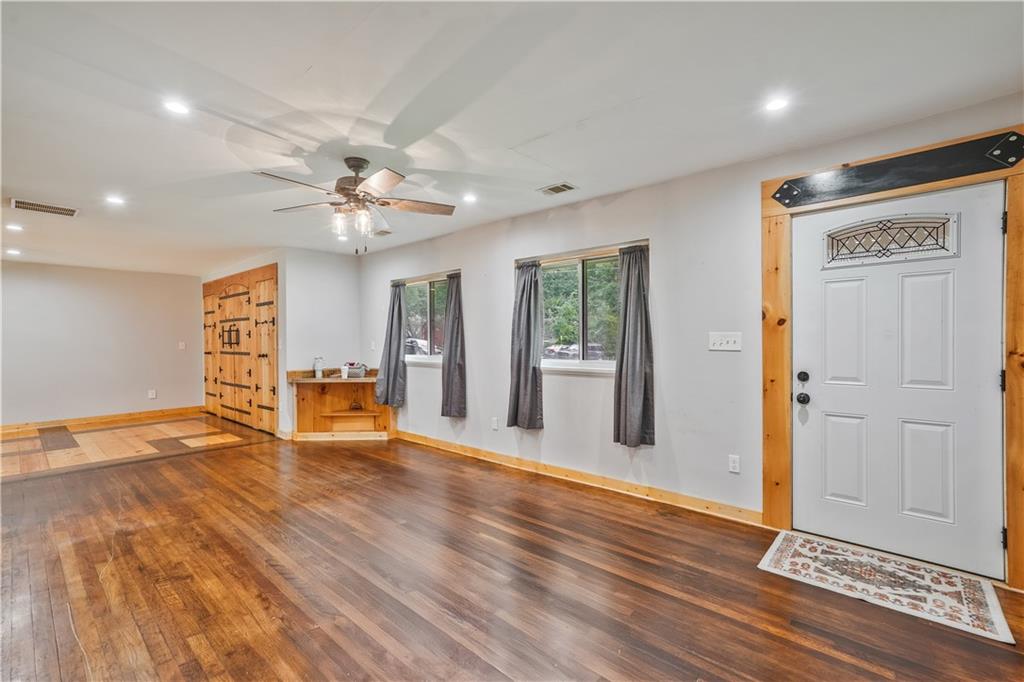 3225 Spring Drive Northwest Atlanta, GA 30360 - Photo 5 of 28 a view of an empty room with window and wooden floor