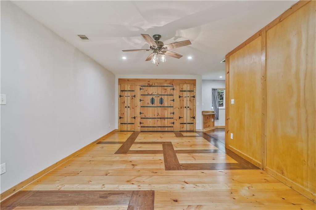 3225 Spring Drive Northwest Atlanta, GA 30360 - Photo 8 of 28 a view of a hallway with a chandelier