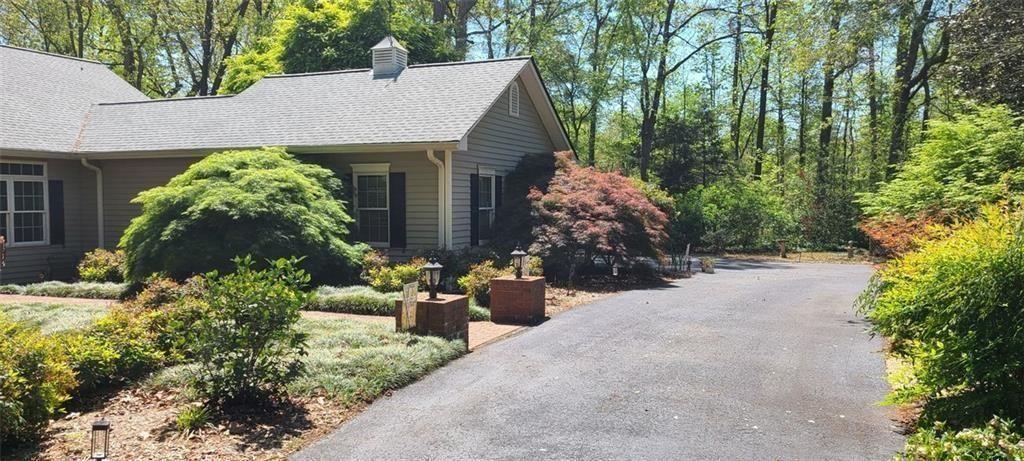 731 Hidden Lakes Trail Jefferson, GA 30549 - Photo 2 of 70 a view of a house with potted plants