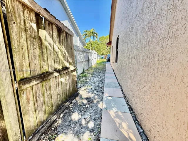 a view of a pathway door with wooden floor