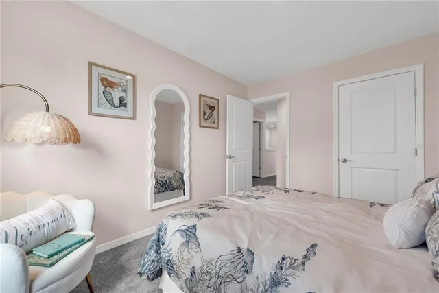 a bedroom with a bed and a couch