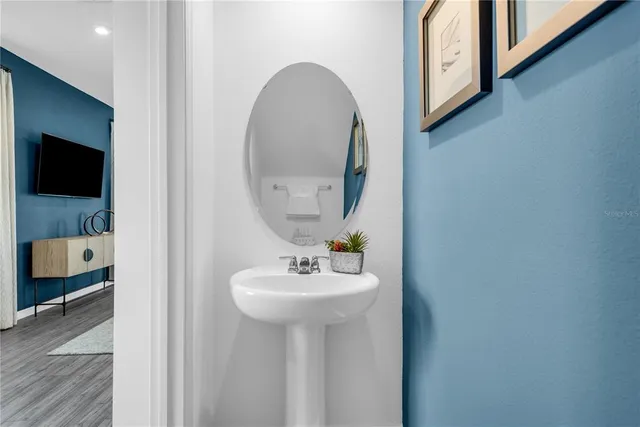 a bathroom with a sink and a mirror