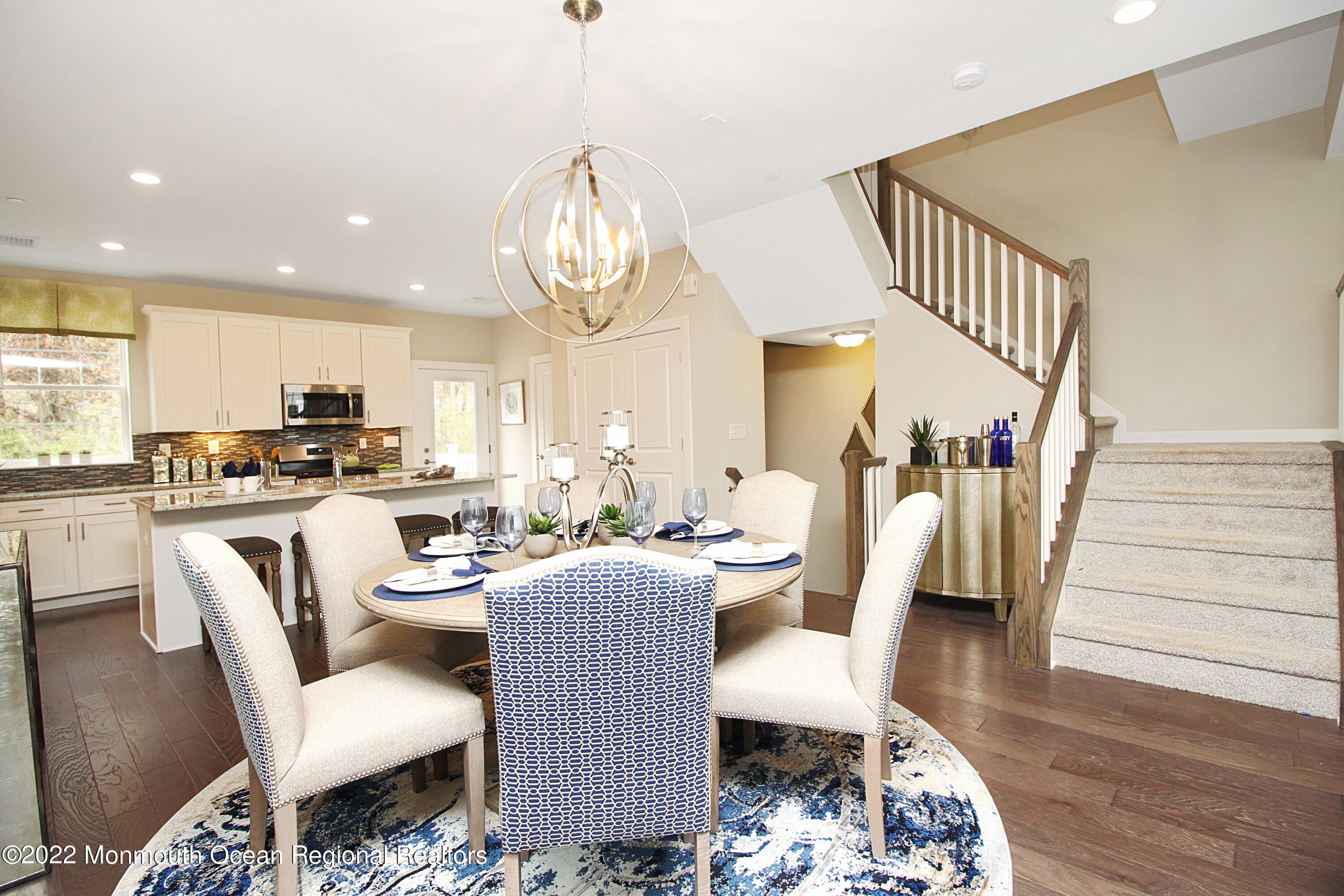 2302 Jamison Road Monroe Township, NJ 08831 - Photo 3 of 18 a living room with lots of furniture and kitchen view
