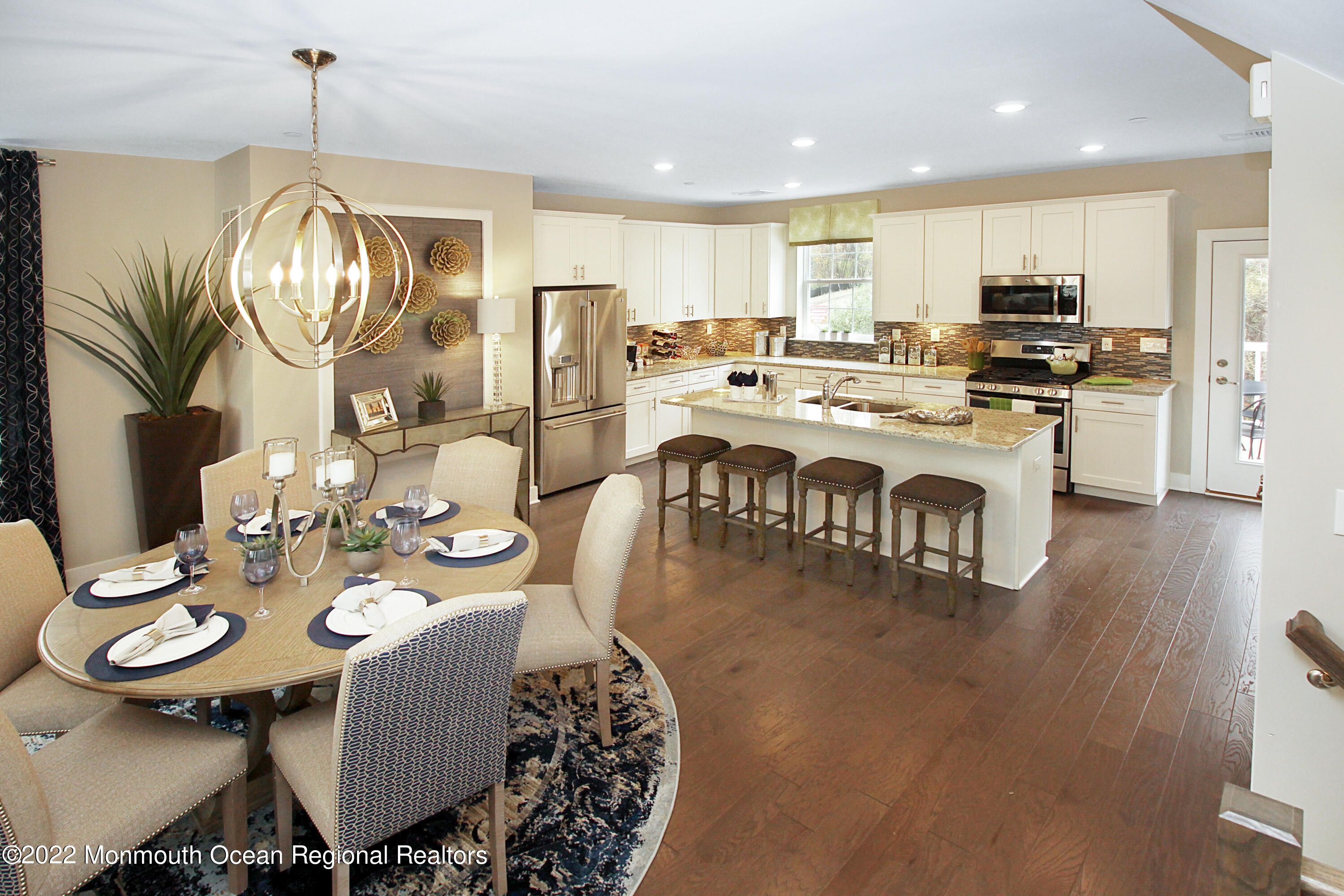 2302 Jamison Road Monroe Township, NJ 08831 - Photo 5 of 18 a view of a dining room with furniture wooden floor and chandelier