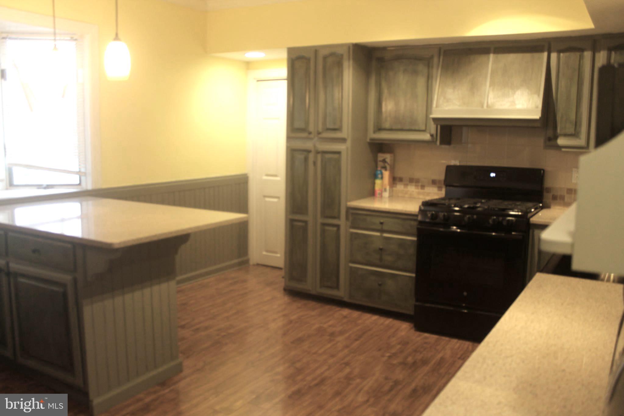 29 Lincoln Avenue Clementon, NJ 08021 - Photo 13 of 36 a kitchen with a refrigerator and a sink