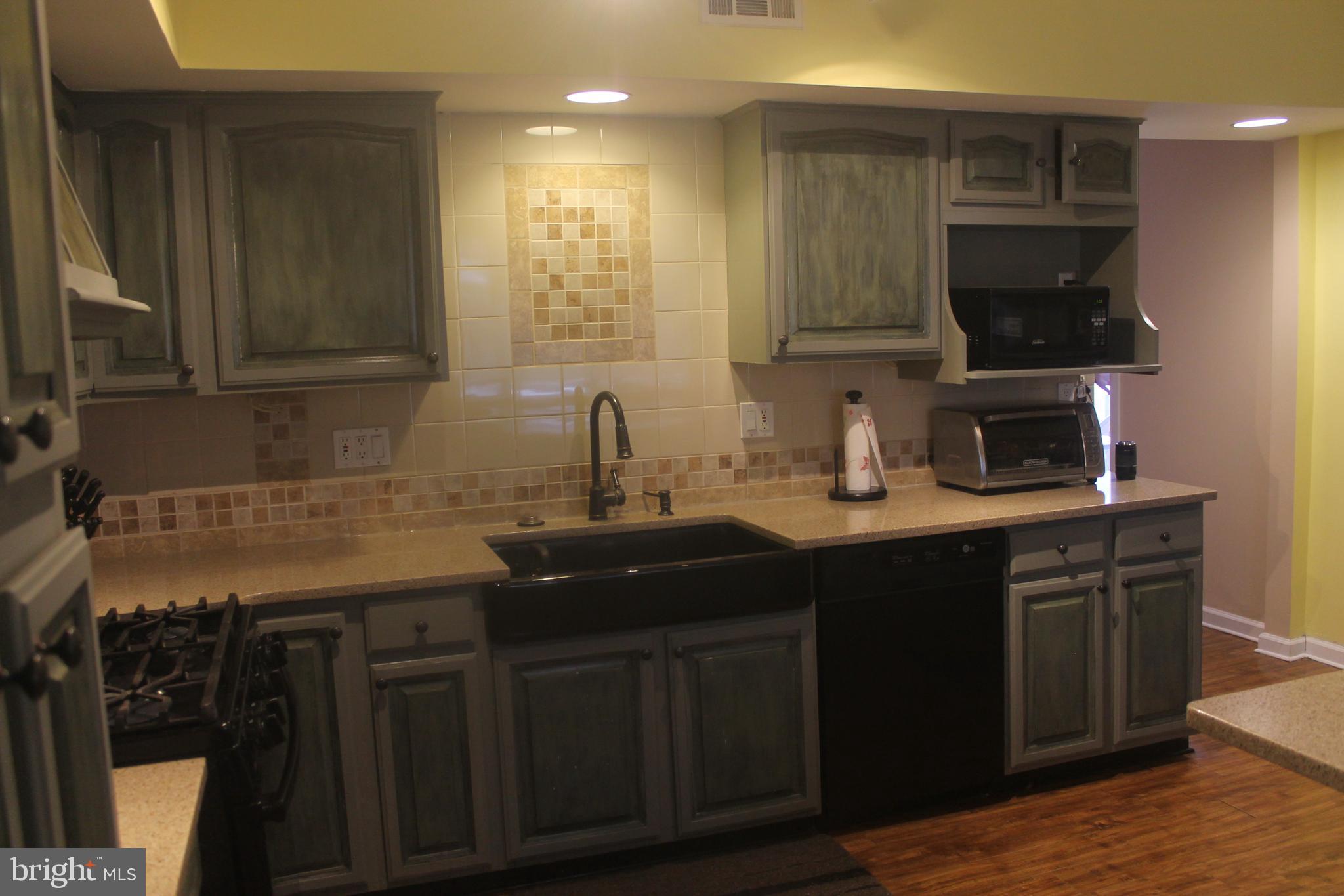 29 Lincoln Avenue Clementon, NJ 08021 - Photo 16 of 36 a kitchen with a sink stainless steel appliances and cabinets
