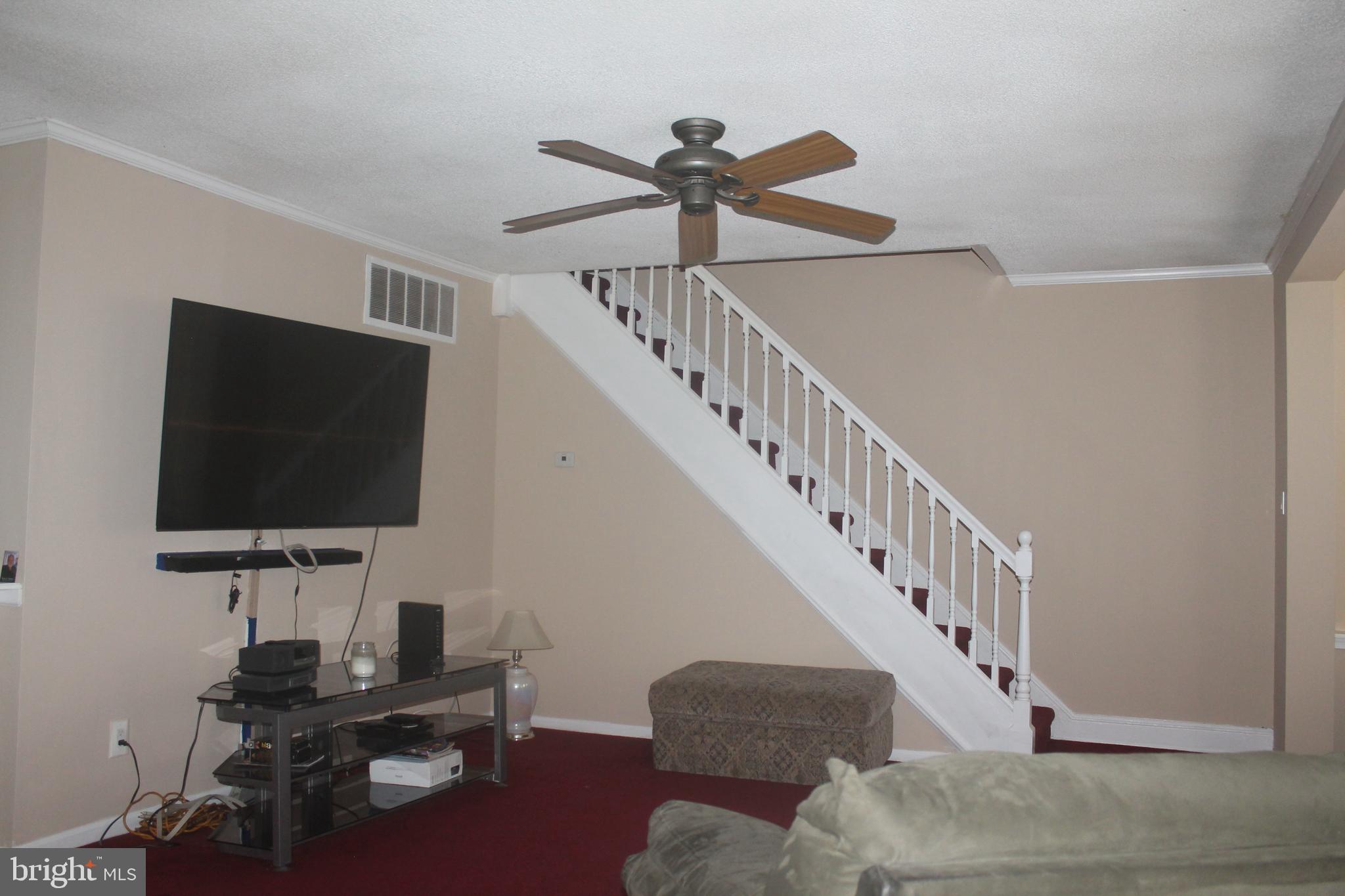 29 Lincoln Avenue Clementon, NJ 08021 - Photo 20 of 36 a living room with furniture and a flat screen tv