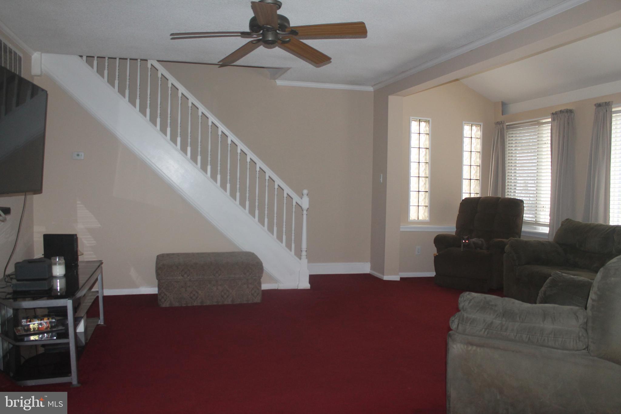 29 Lincoln Avenue Clementon, NJ 08021 - Photo 21 of 36 a living room with furniture and a flat screen tv