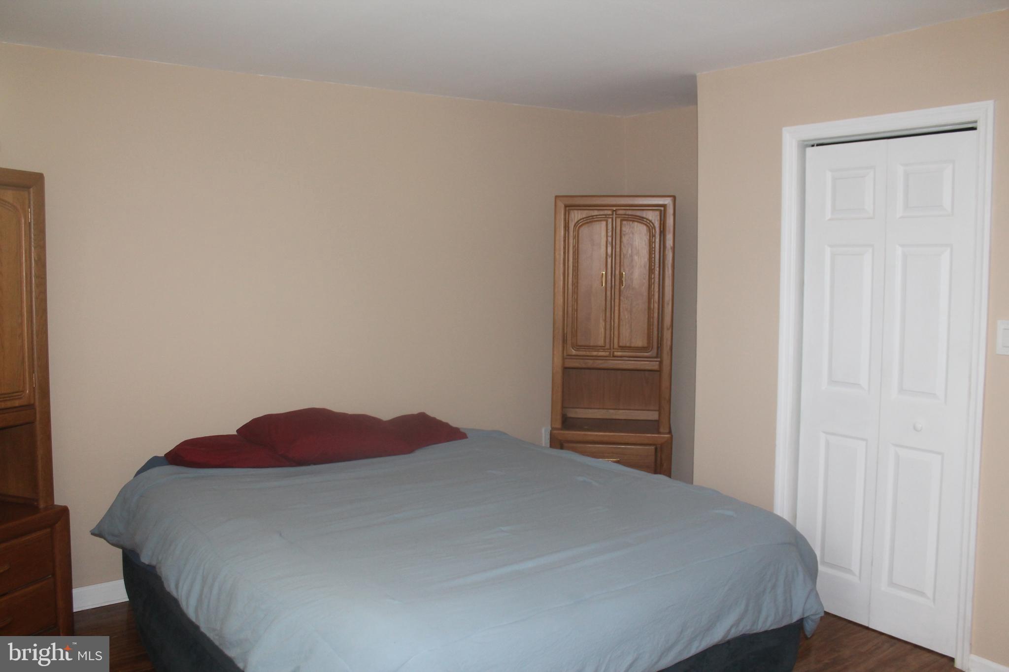 29 Lincoln Avenue Clementon, NJ 08021 - Photo 27 of 36 a bedroom with a bed and a closet