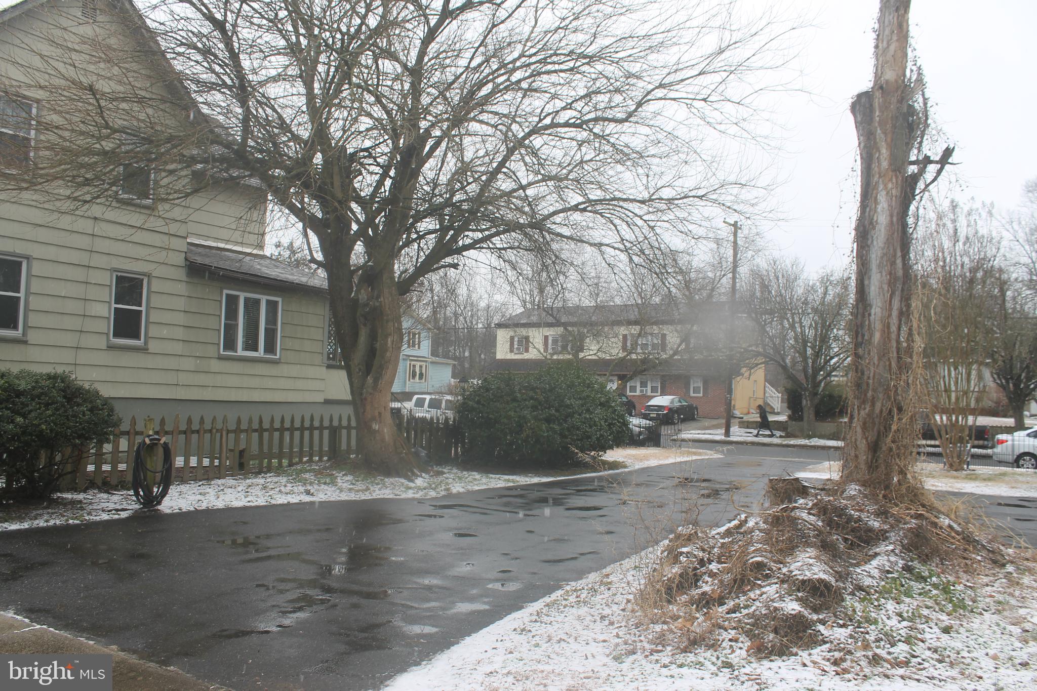 29 Lincoln Avenue Clementon, NJ 08021 - Photo 5 of 36 a view of a house with a yard covered with snow