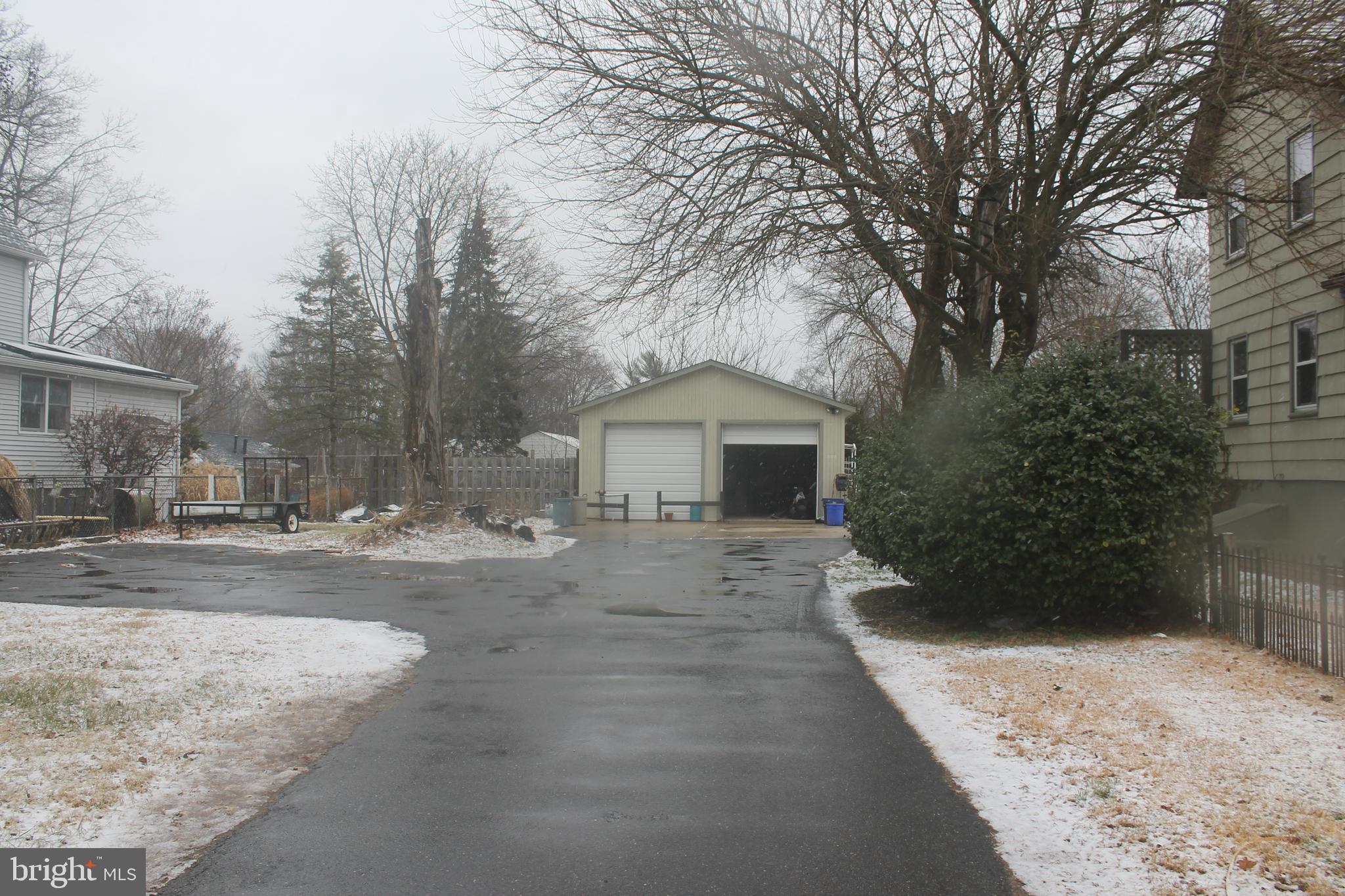 29 Lincoln Avenue Clementon, NJ 08021 - Photo 9 of 36 a front view of a house with a yard and garage