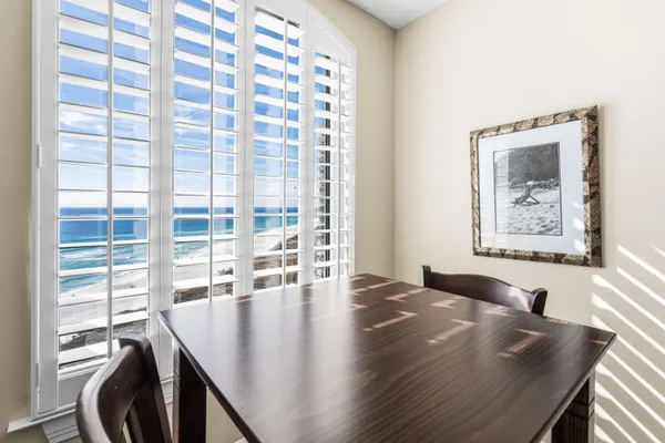 a view of a dining room with furniture and window