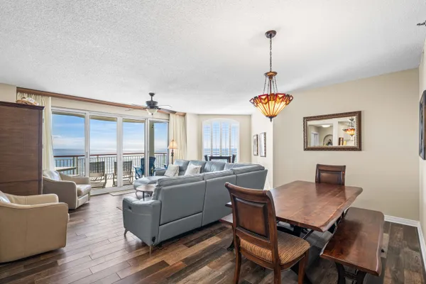 a view of a dining room with furniture window and wooden floor