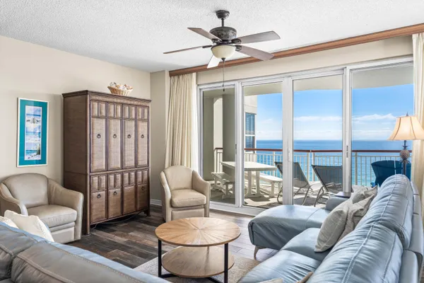 a living room with furniture and a large window