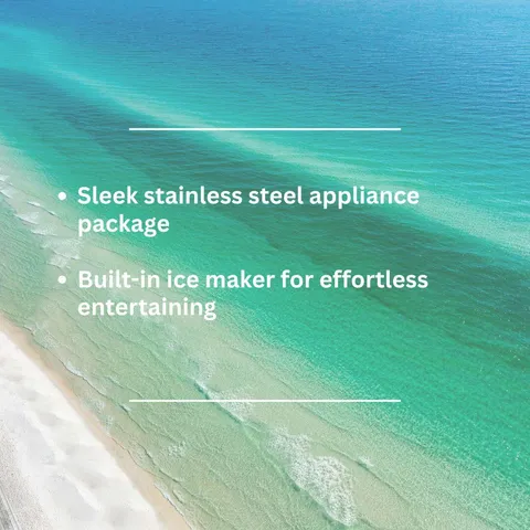 a white kitchen with granite countertop stainless steel appliances