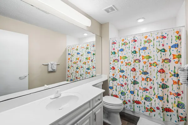 a bathroom with a sink and toilet
