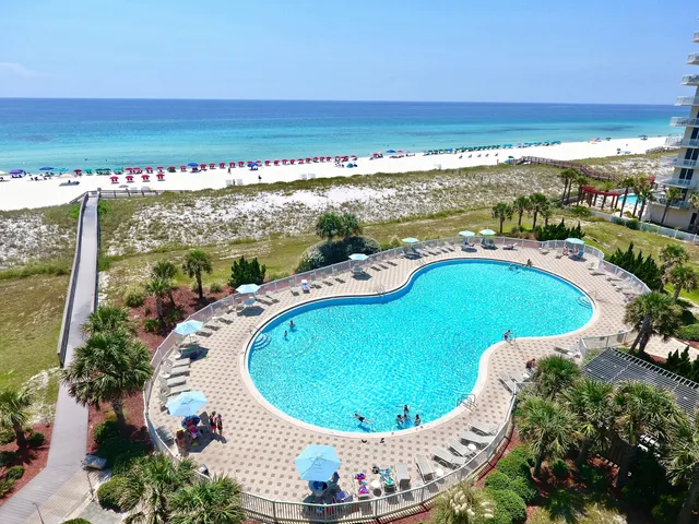 a view of swimming pool with outdoor seating