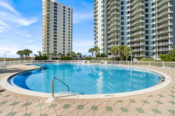 a view of swimming pool with outdoor seating