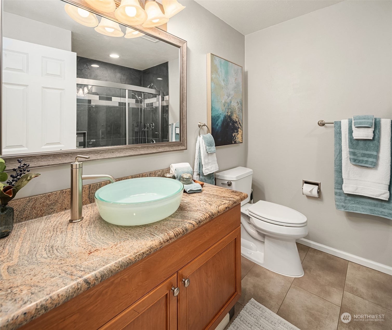 307 Elm Street Everett, WA 98203 - Photo 22 of 31 a bathroom with a granite countertop sink and a mirror