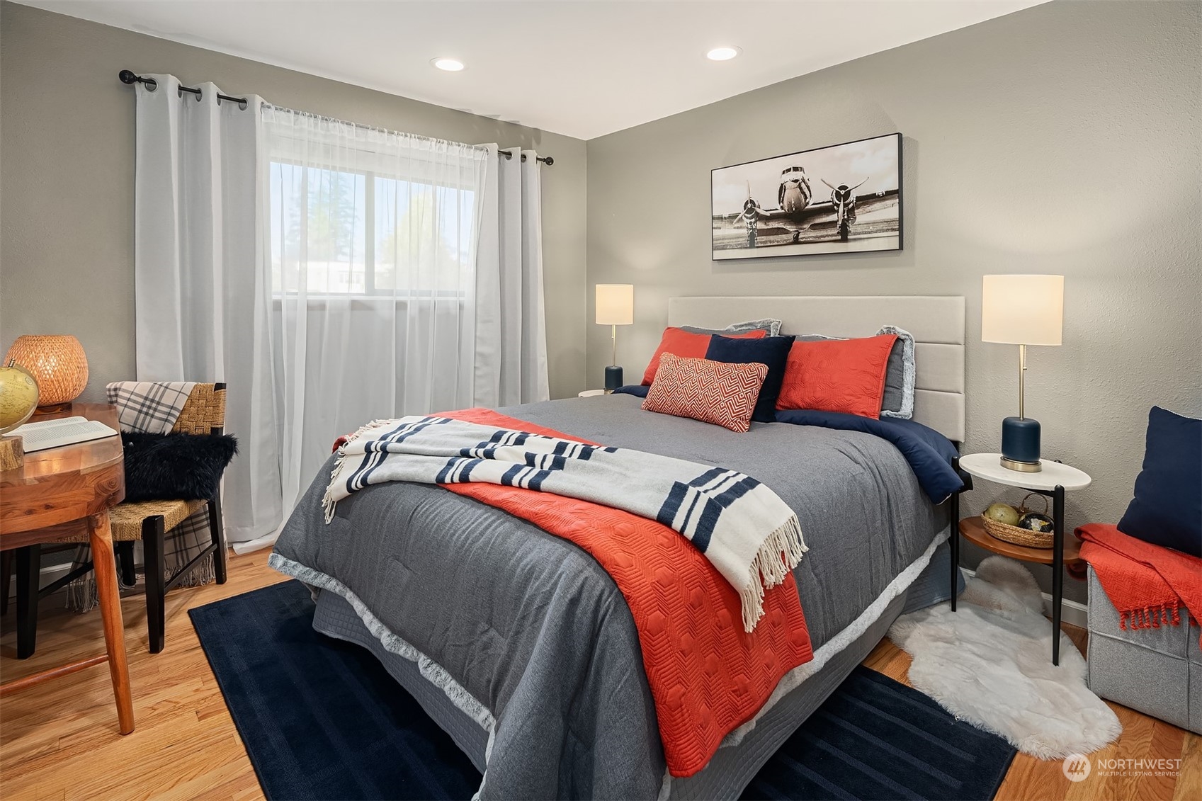 307 Elm Street Everett, WA 98203 - Photo 23 of 31 a bedroom with a bed and wooden floor