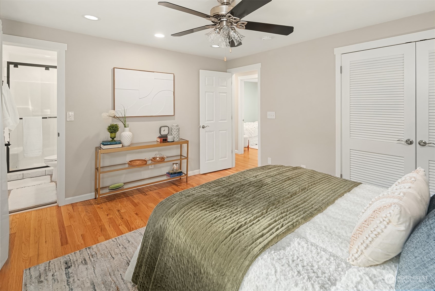 307 Elm Street Everett, WA 98203 - Photo 26 of 31 a bedroom with a bed and a chandelier