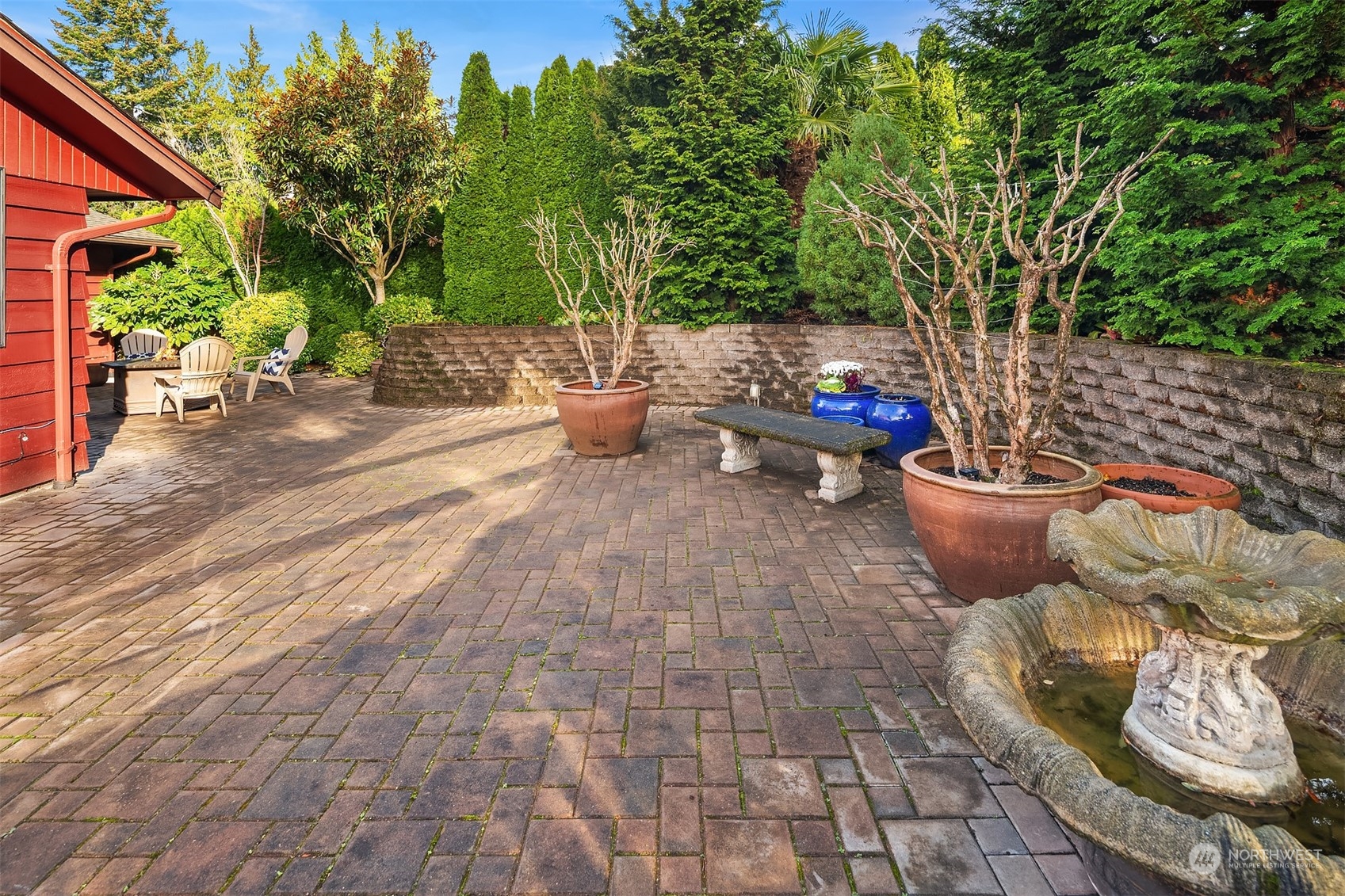 307 Elm Street Everett, WA 98203 - Photo 28 of 31 a view of a backyard with sitting area and potted plants