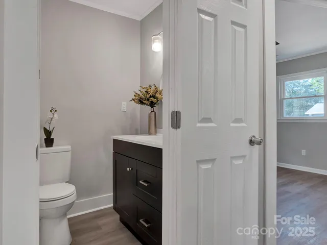 a bathroom with a toilet a sink and shower