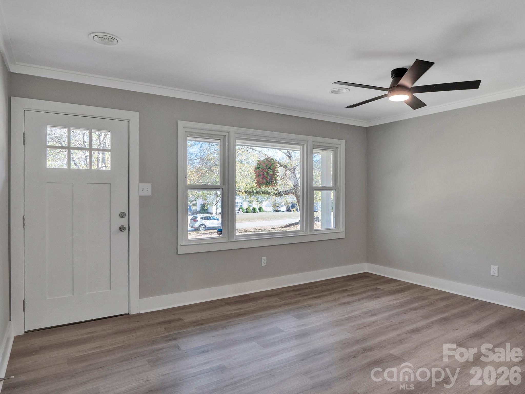 2826 State Rd S-29-656 Lancaster, SC 29720 - Photo 10 of 31 a view of an empty room with wooden floor and a window