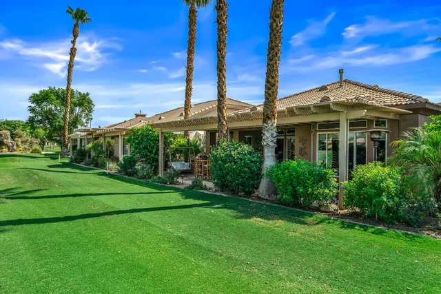 a patio with a table and chairs