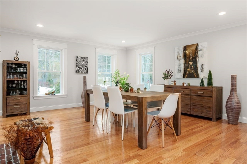 367 Powder Mill Road Concord, MA 01742 - Photo 12 of 42 a view of a dining room with furniture and wooden floor