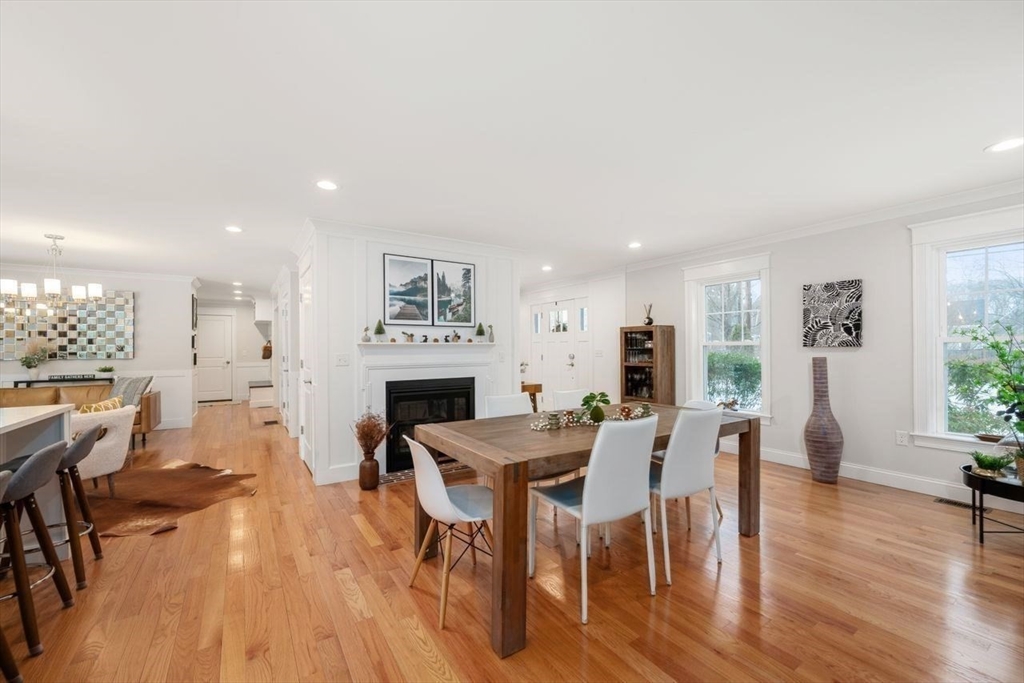 367 Powder Mill Road Concord, MA 01742 - Photo 14 of 42 a view of a dining room with furniture and wooden floor