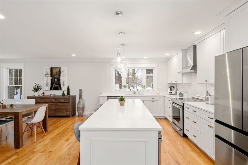 367 Powder Mill Road Concord, MA 01742 - Photo 18 of 42 a kitchen that has a lot of white cabinets and stainless steel appliances