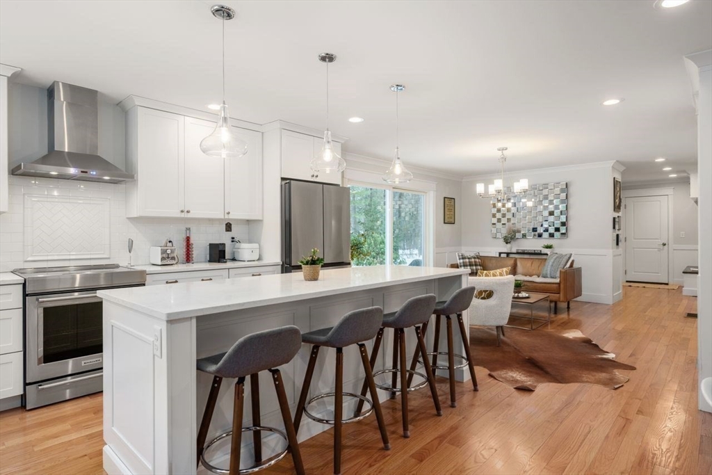 367 Powder Mill Road Concord, MA 01742 - Photo 20 of 42 a large kitchen with a table and chairs