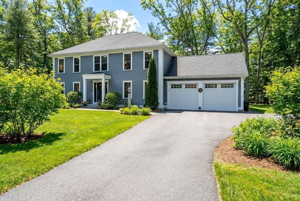 367 Powder Mill Road Concord, MA 01742 - Photo 2 of 42 a front view of a house with yard and green space