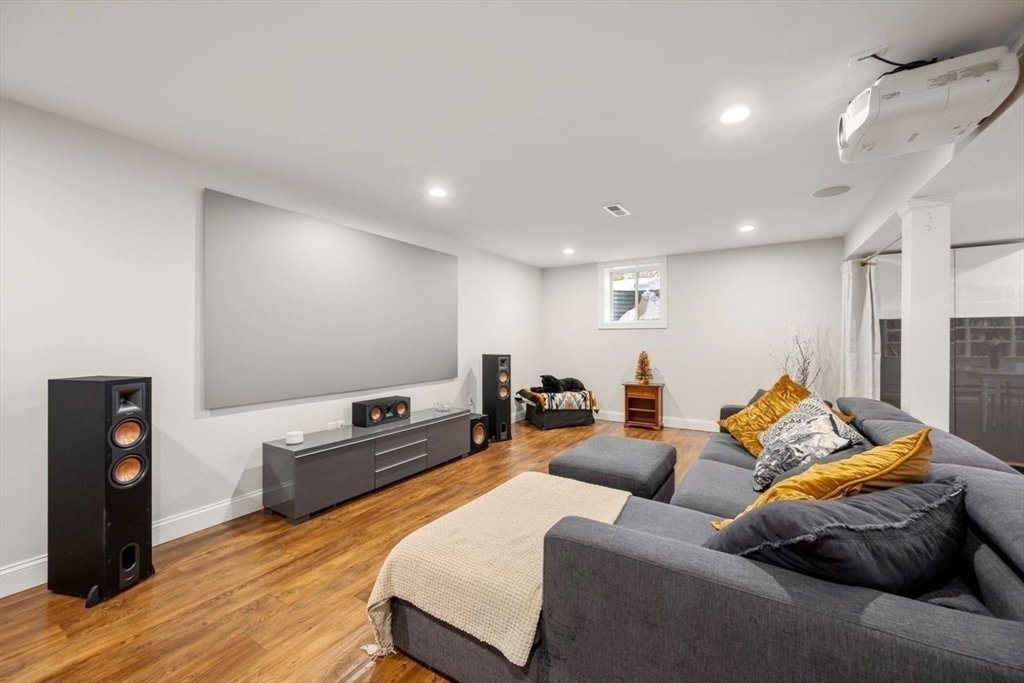 367 Powder Mill Road Concord, MA 01742 - Photo 26 of 42 a living room with furniture and a flat screen tv