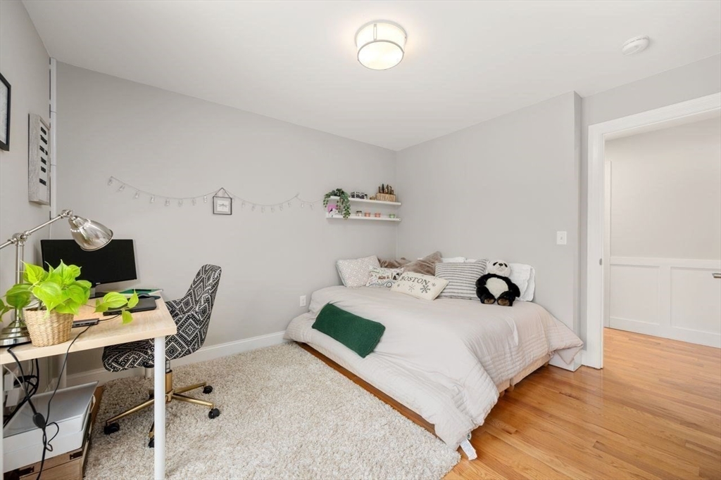 367 Powder Mill Road Concord, MA 01742 - Photo 29 of 42 a bedroom with a bed and a table in it
