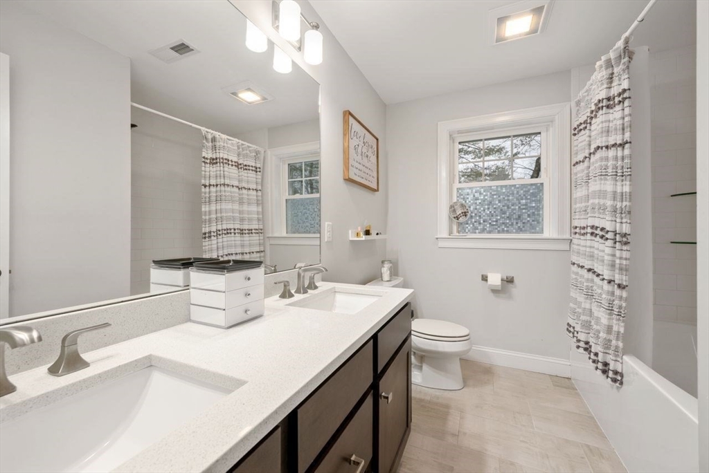 367 Powder Mill Road Concord, MA 01742 - Photo 30 of 42 a bathroom with a sink a toilet and shower