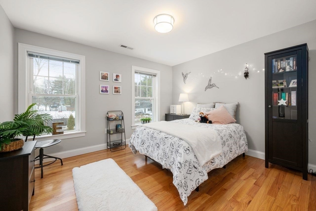 367 Powder Mill Road Concord, MA 01742 - Photo 31 of 42 a bedroom with a large bed and windows
