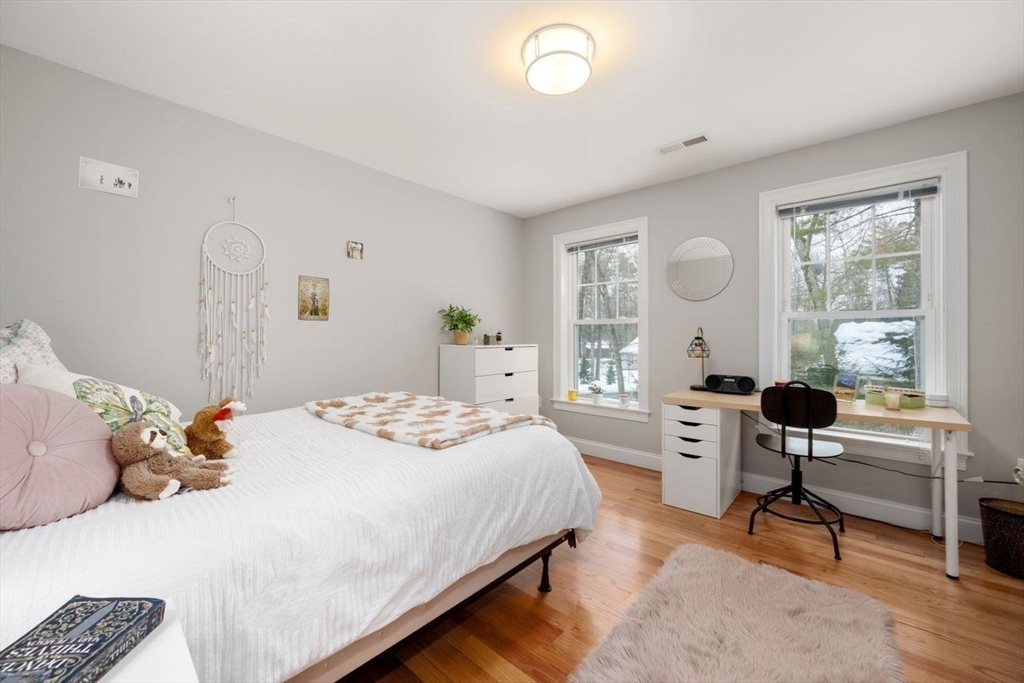 367 Powder Mill Road Concord, MA 01742 - Photo 33 of 42 a bedroom with a bed and a large window