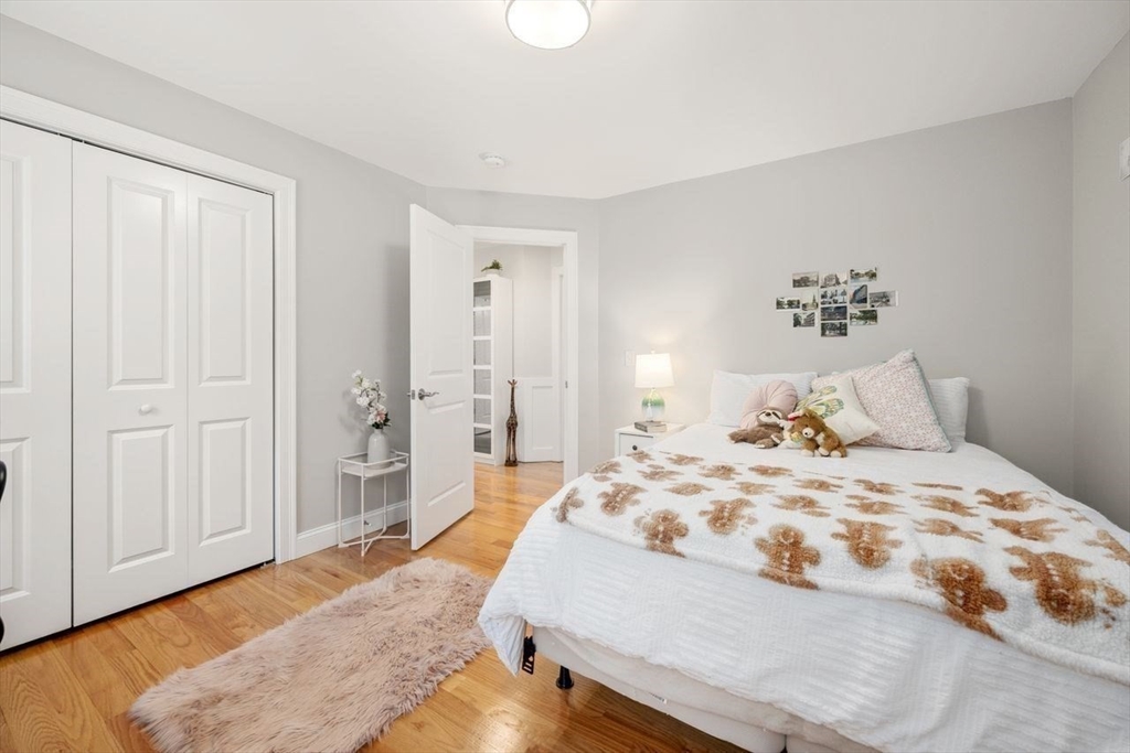 367 Powder Mill Road Concord, MA 01742 - Photo 34 of 42 a bedroom with a bed and a couch