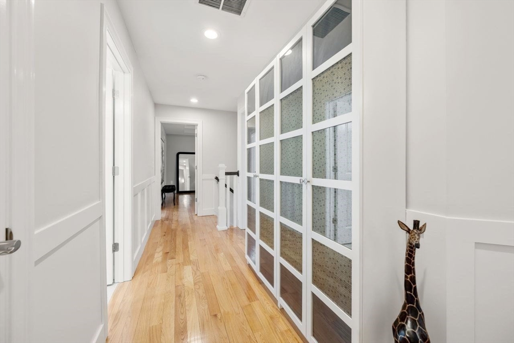 367 Powder Mill Road Concord, MA 01742 - Photo 35 of 42 a view of a hallway with wooden floor and entryway
