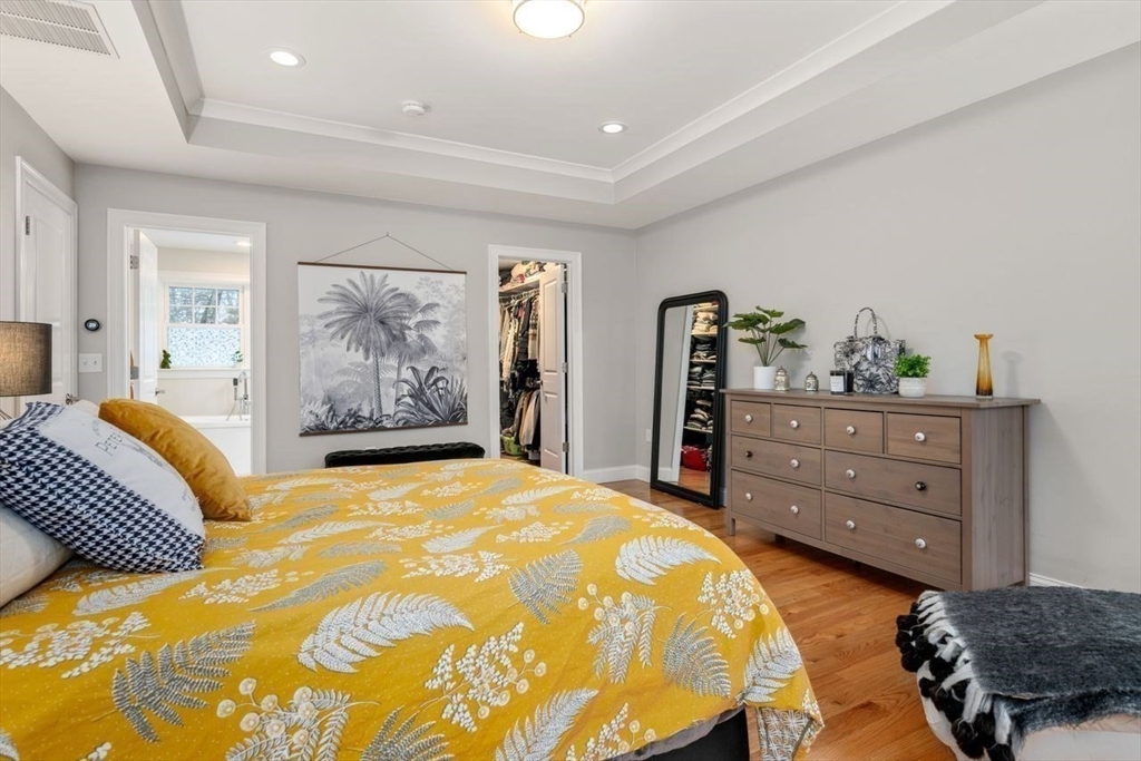 367 Powder Mill Road Concord, MA 01742 - Photo 40 of 42 a bedroom with a bed and a dresser