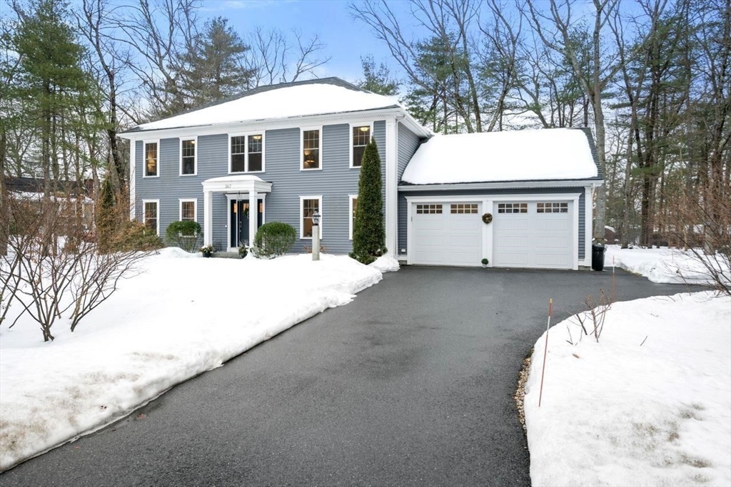 367 Powder Mill Road Concord, MA 01742 - Photo 41 of 42 a view of a white house with a yard covered in snow