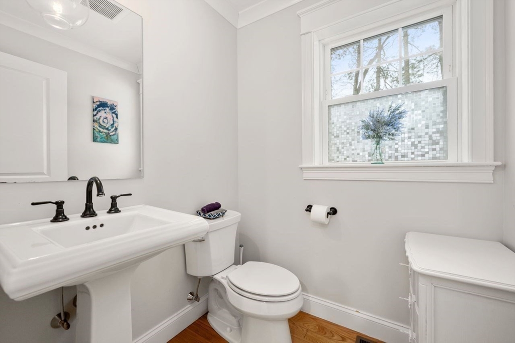367 Powder Mill Road Concord, MA 01742 - Photo 9 of 42 a bathroom with a toilet a sink and a window