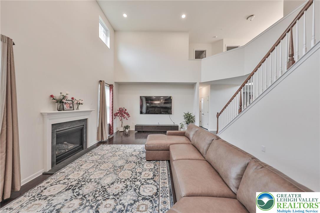 338 Abby Road Macungie, PA 18062 - Photo 20 of 40 a living room with furniture and a fireplace