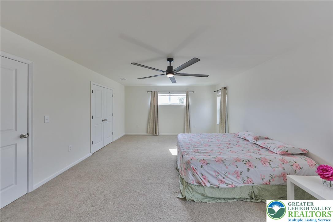 338 Abby Road Macungie, PA 18062 - Photo 29 of 40 a bedroom with a bed and window