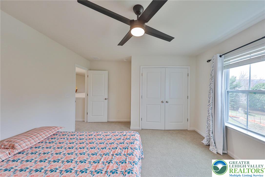 338 Abby Road Macungie, PA 18062 - Photo 36 of 40 a bedroom with a bed and a large window